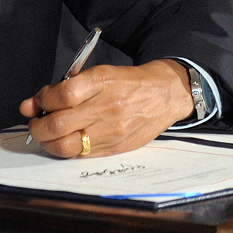 Barack Obama signing charter into law